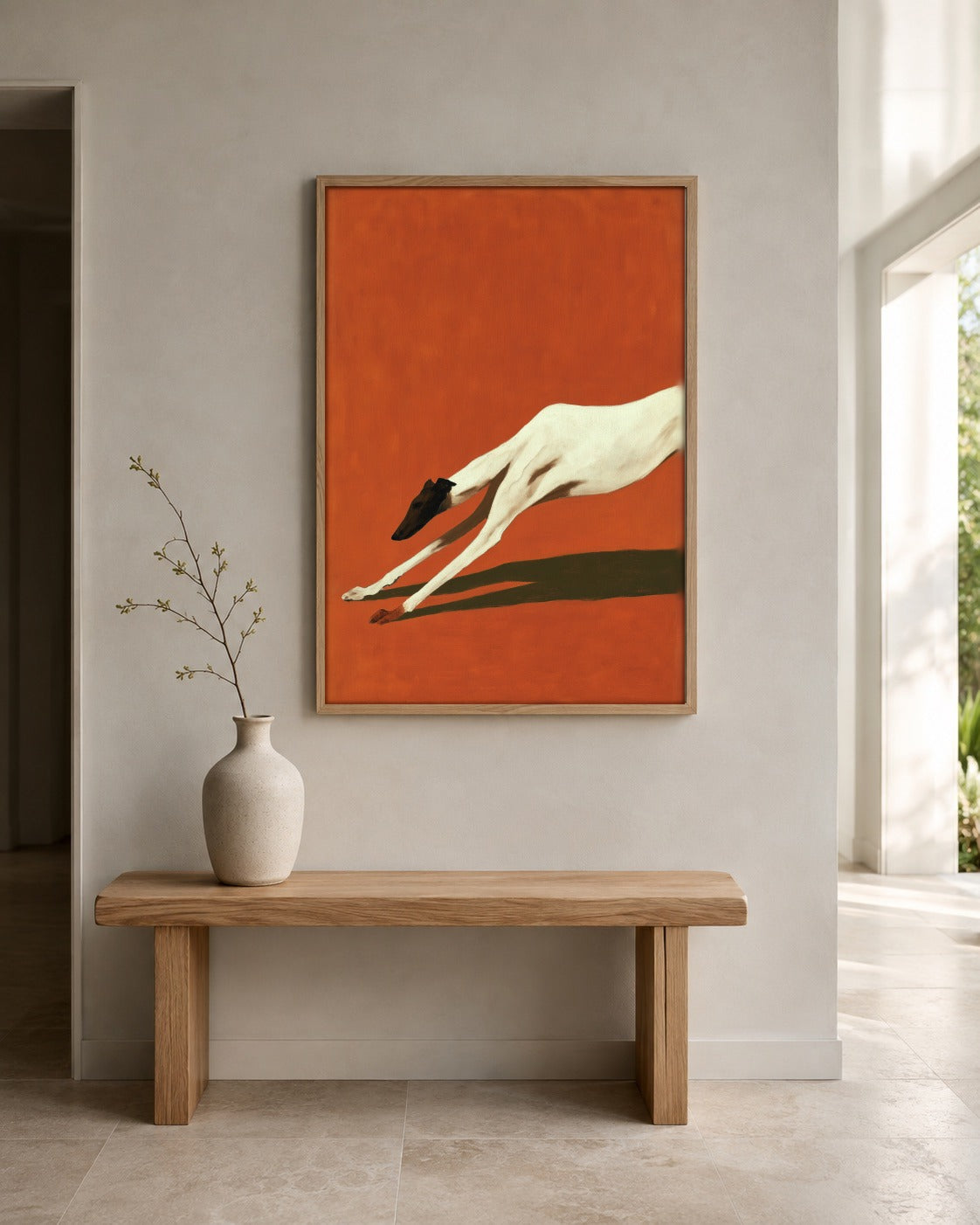 The Long Stretch stretching greyhound wall art displayed in a home interior